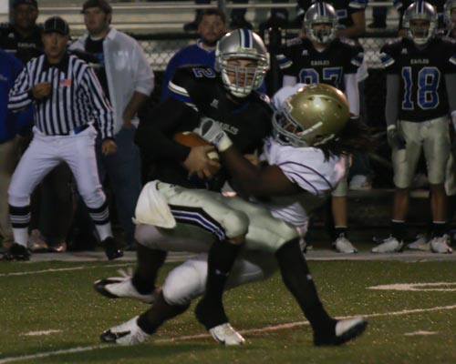 Bethel's Van Alexander brings down Faulkner University QB David Jones.  Alexander had 6 tackles and 1.5 sacks.